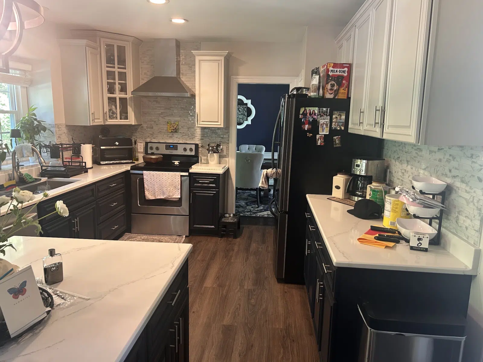 Kitchen with two-tone white and black painted cabinets — Father And Son Custom Painting in Raleigh