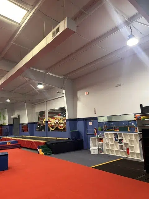 Gym interior with blue and white painted walls — Father And Son Custom Painting in Raleigh