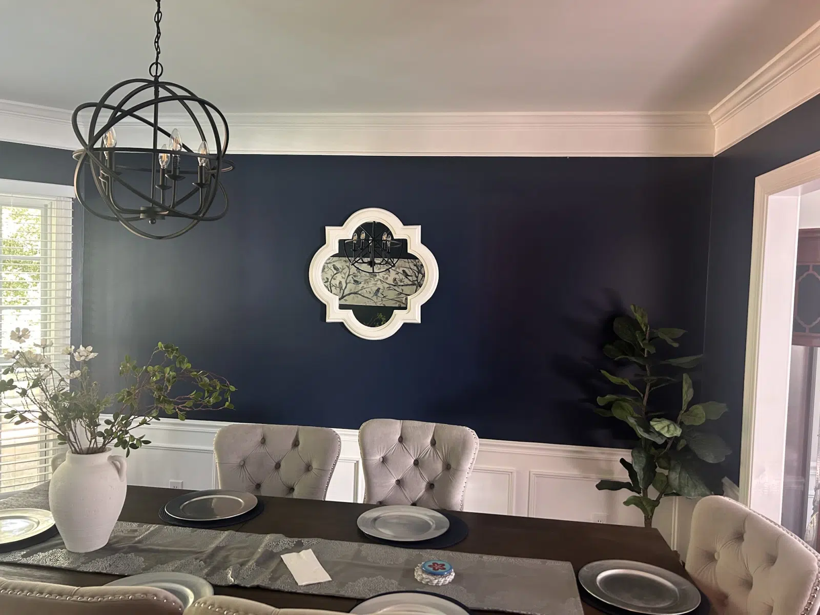 Navy accent wall with white wainscoting in dining room — Father And Son Custom Painting in Raleigh